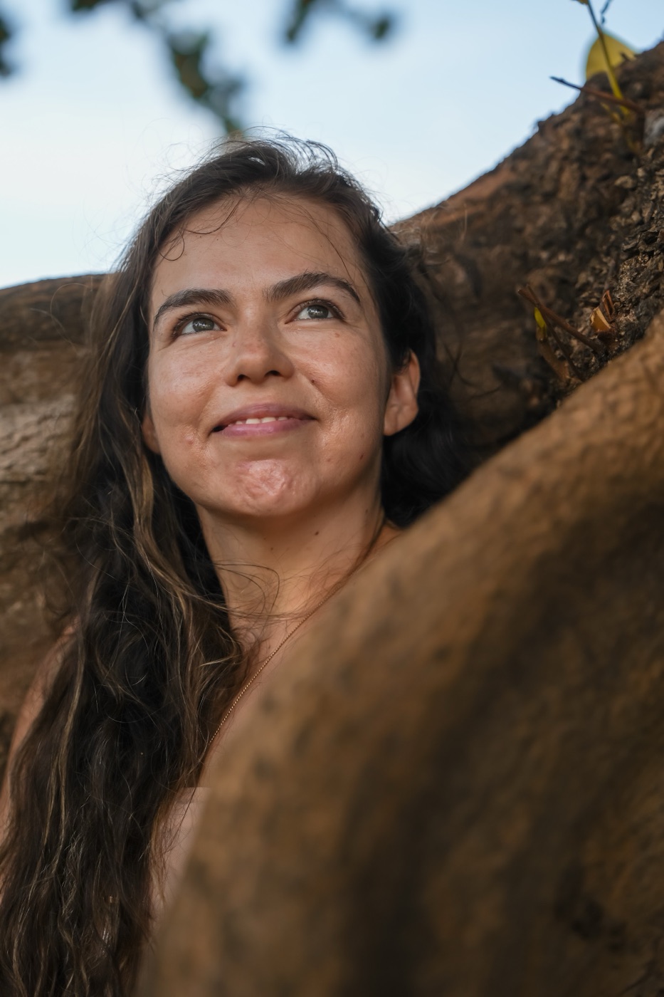 Portrait of Kali smiling under a tree